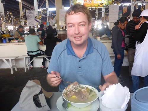 James eating soup at the market